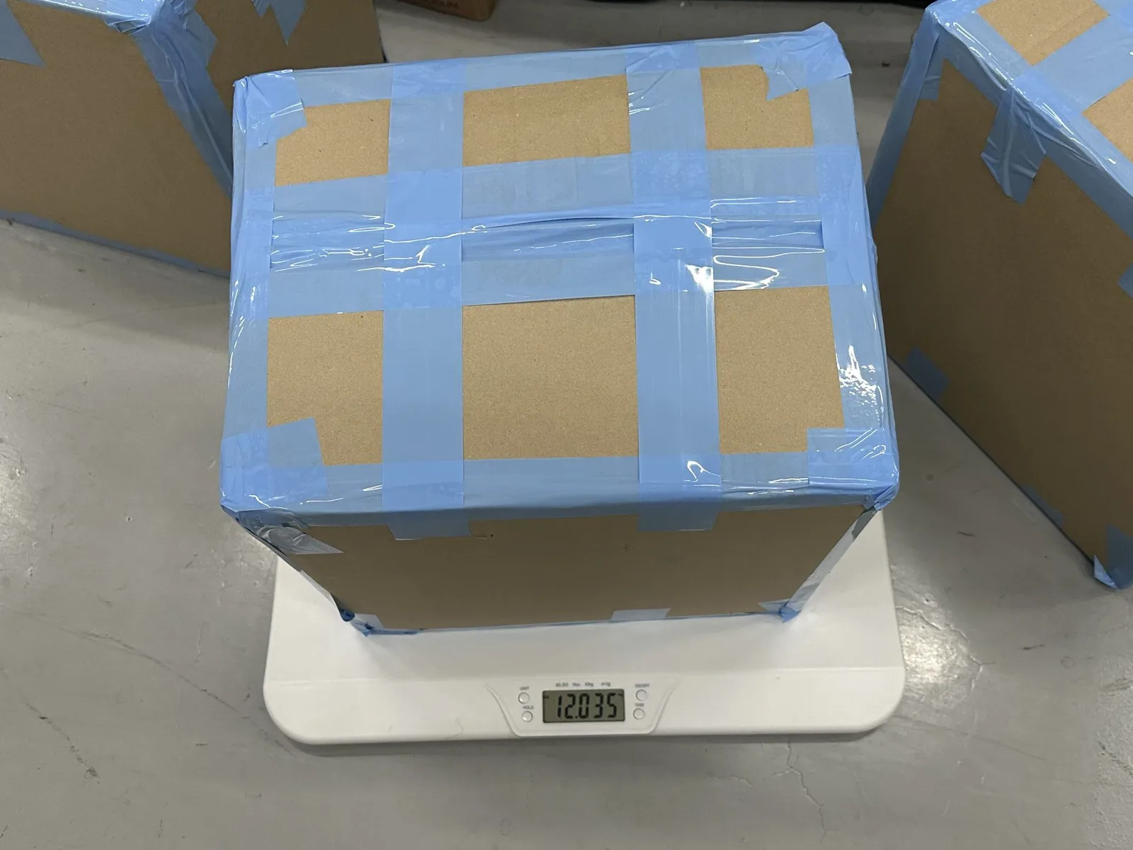 Second consolidated K-pop shipment carton on a digital scale