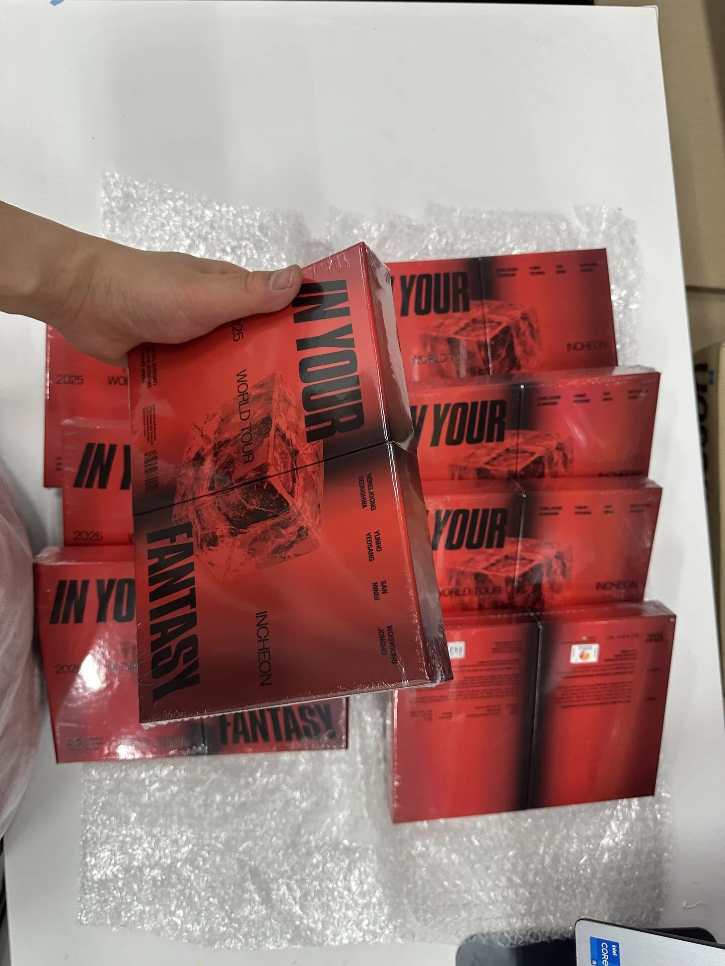KIKIT staff checking the visible condition of a K-pop album