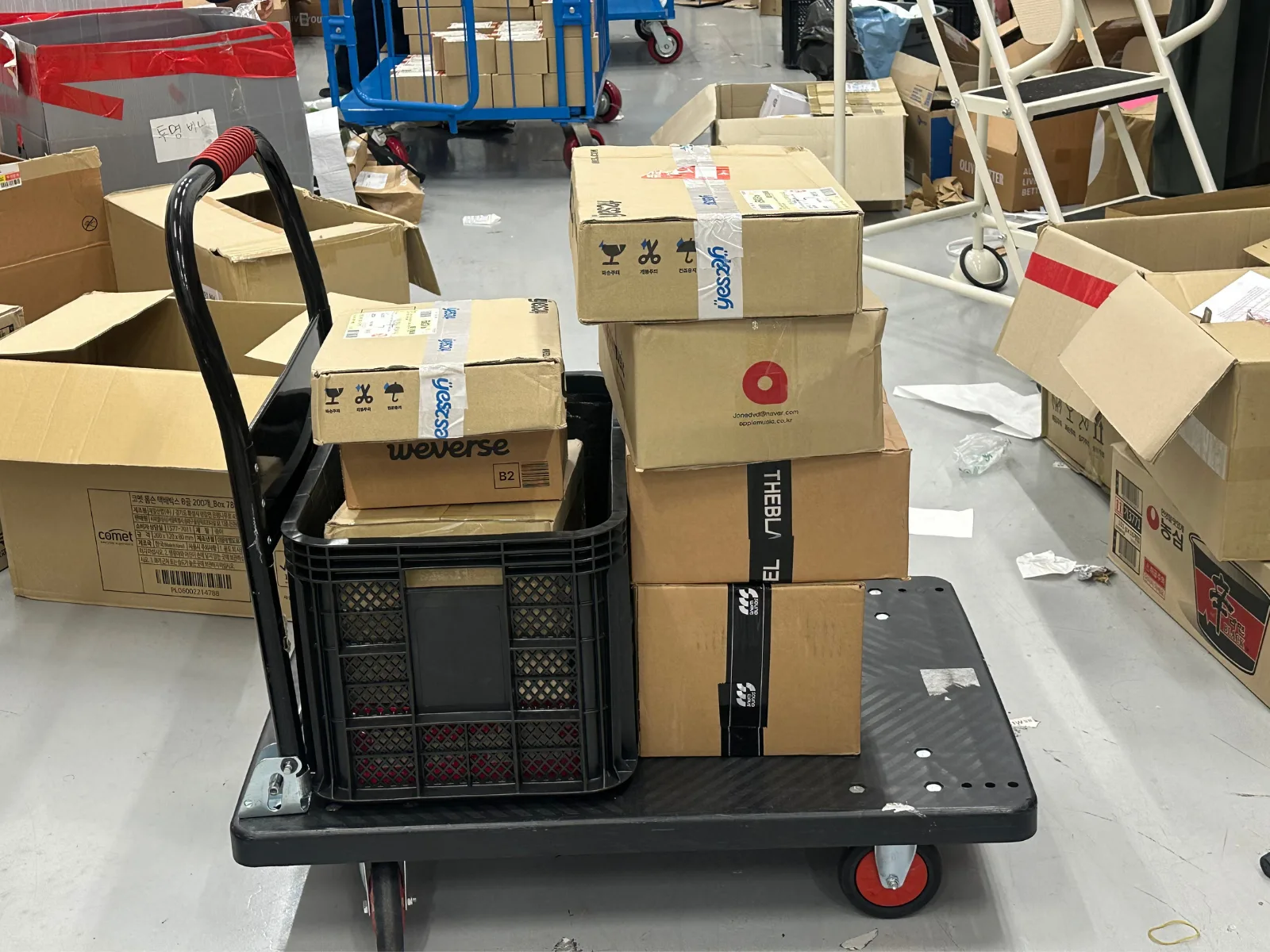 Korean seller parcels stacked on a cart after arriving at KIKIT