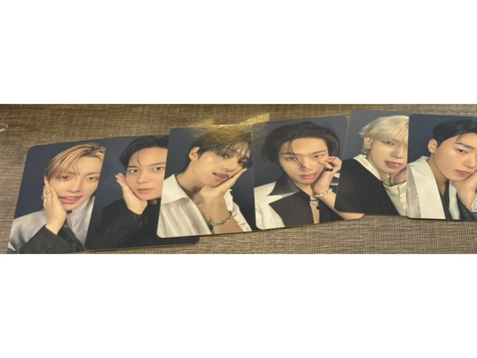 Six replacement ATEEZ photocards received after the retailer claim